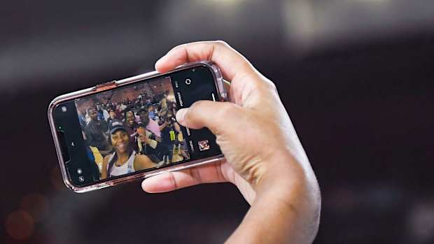 South Carolina forward Aliyah Boston (4) takes a selfie with her family after beating Maryland in the NCAA Women's Elite Eight Basketball Tournament at Bon Secours Wellness Arena in Greenville, S.C. Monday, March 27, 2023. Gre Ml Ncaaelite8uscvmd 03272023 022